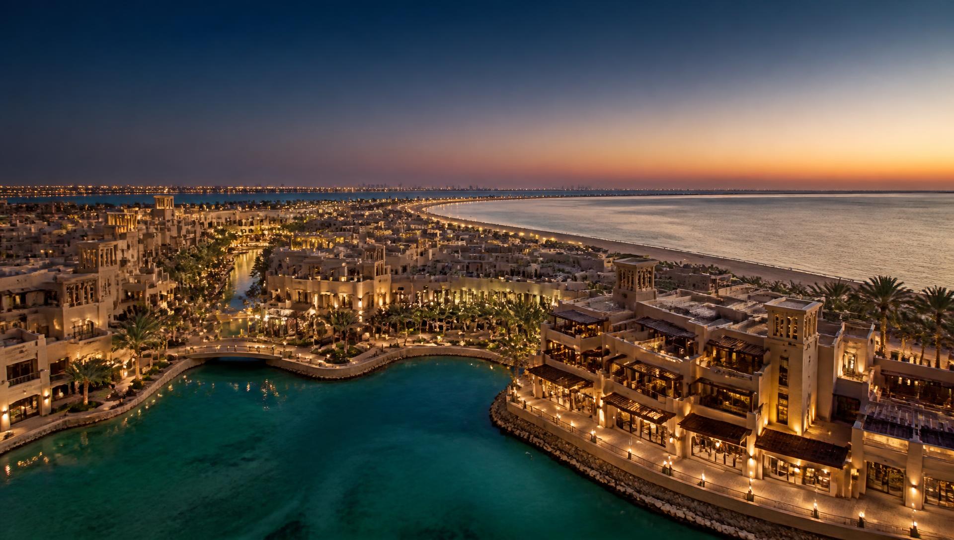 Coastal destination masterplan at dusk in the Gulf